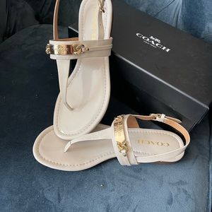 Luxurious Ivory COACH sandals with gold tone hardware